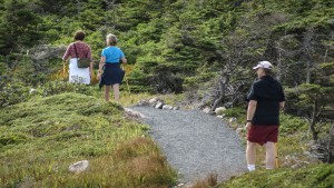 People walking on gravel trail in Louisbourg Nova Scotia, Canada