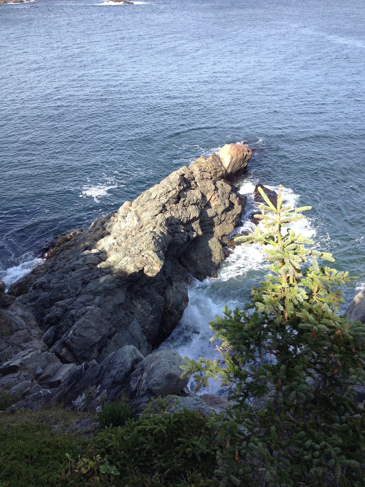 Rock jutting into ocean in Big Lorraine Harbour, Louisbourg Nova Scotia
